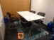 White top conference table + black chairs